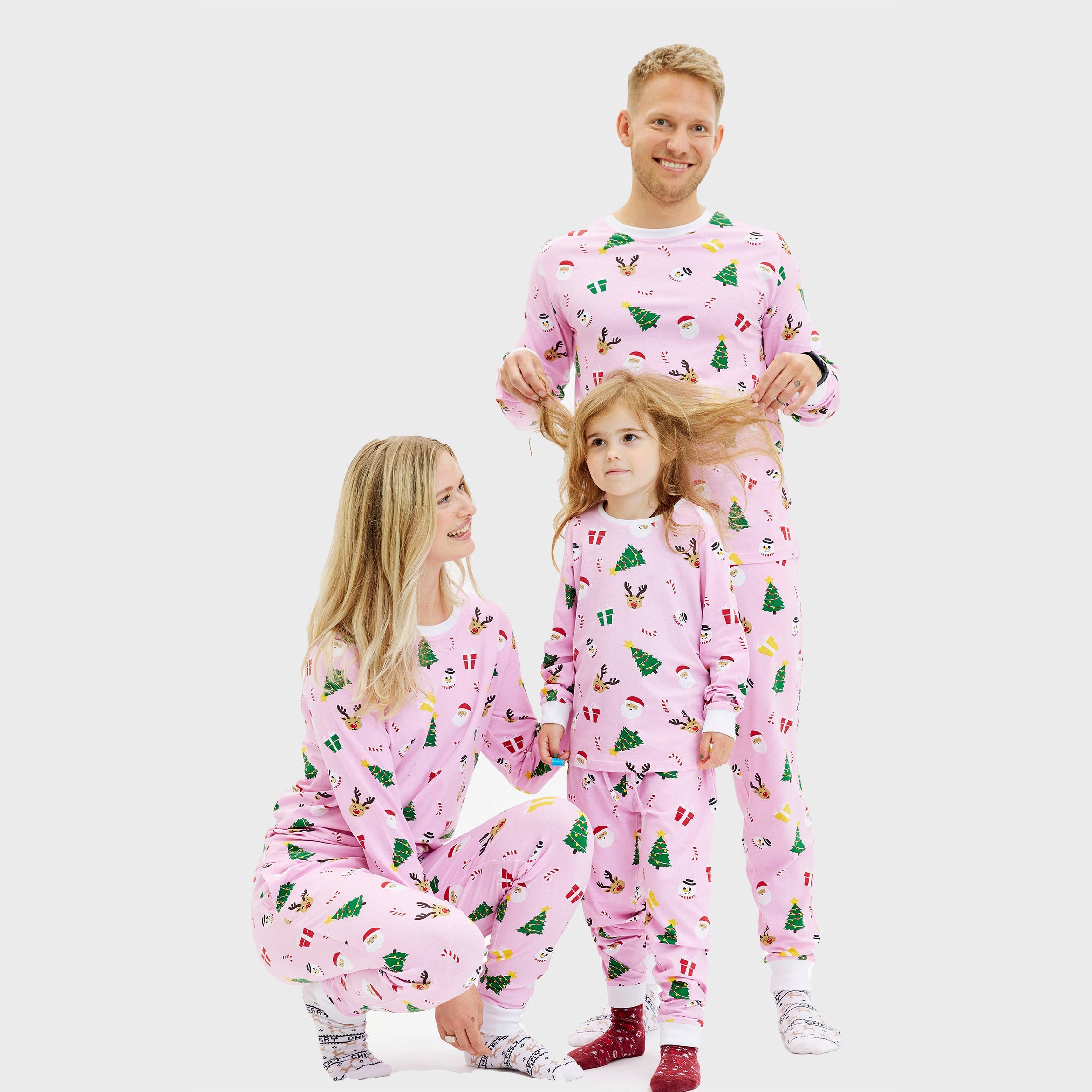 Weihnachtspyjama Damen in Rosa mit buntem Tannenbaum- und Geschenkprint, Weihnachtsweihnachtspullover Herren und Damen.