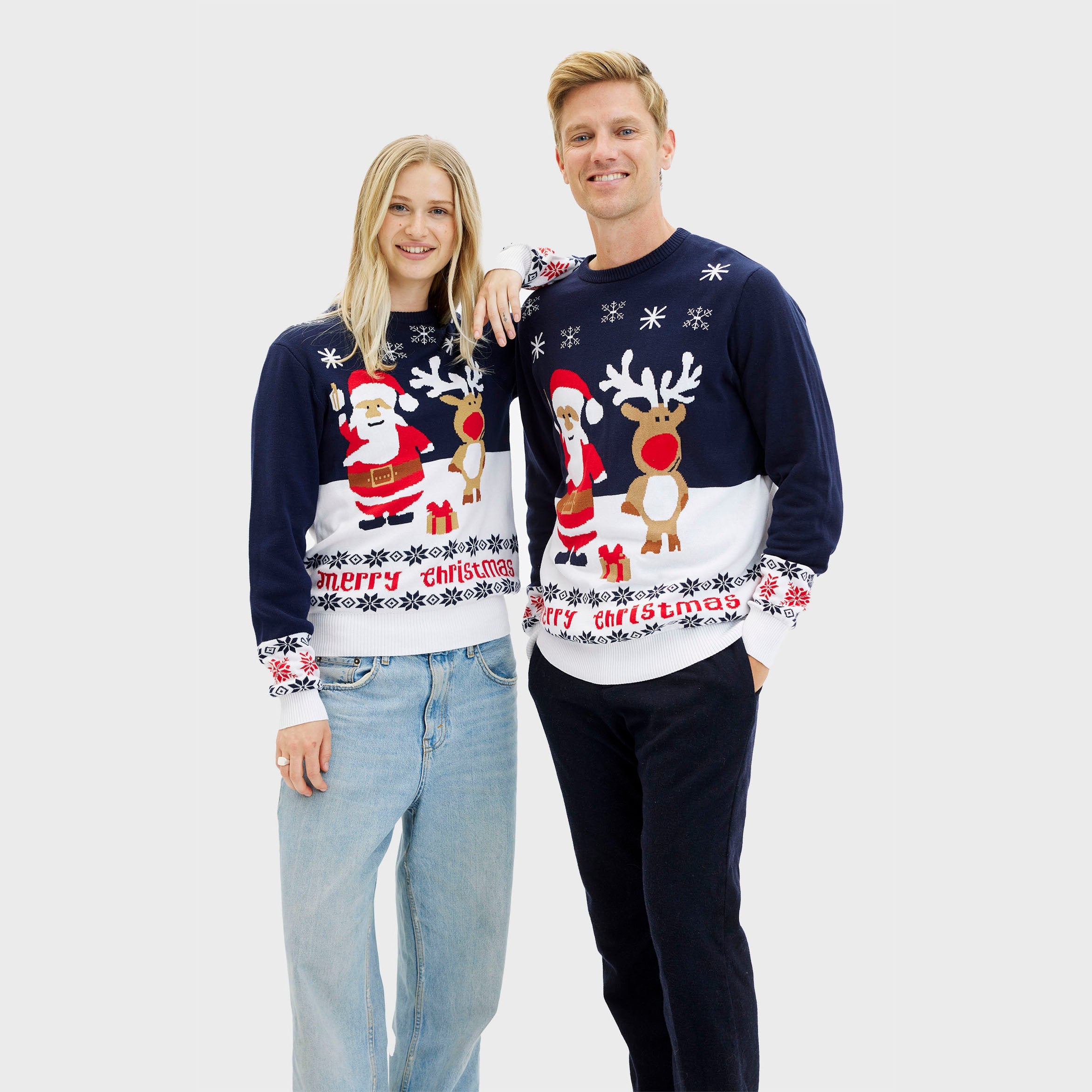 Blauer nachhaltiger Weihnachtspullover Damen und Herren mit Weihnachtsmann und Rentier-Motiv.